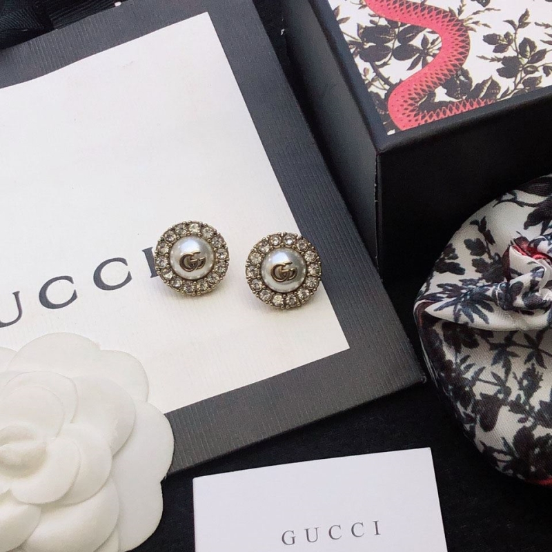 G*u*i earrings